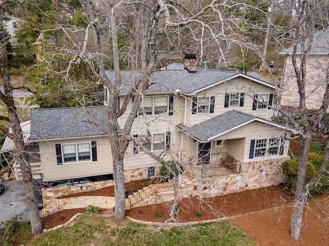 504 Fleetwood Dr, Lookout Mountain, TN 37350 - view of front facade featuring a chimney, a shingled roof, and stone siding