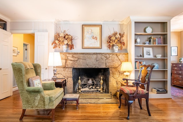 504 Fleetwood Dr, Lookout Mountain, TN 37350 - sitting room featuring wood finished floors, ornamental molding, and a stone fireplace