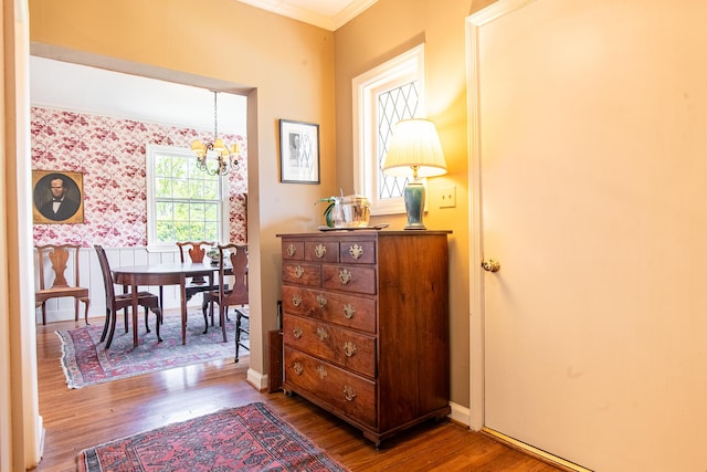 504 Fleetwood Dr, Lookout Mountain, TN 37350 - hall featuring a chandelier, wood finished floors, wallpapered walls, crown molding, and baseboards