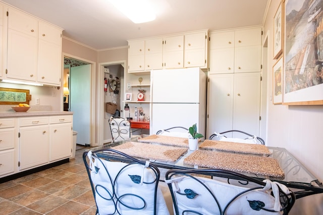 504 Fleetwood Dr, Lookout Mountain, TN 37350 - kitchen featuring freestanding refrigerator, white cabinets, crown molding, and light countertops