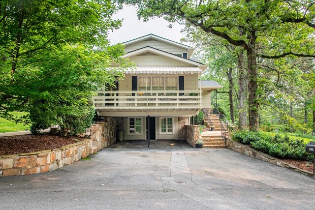 504 Fleetwood Dr, Lookout Mountain, TN 37350 - back of house with stairs, asphalt driveway, a carport, and a deck