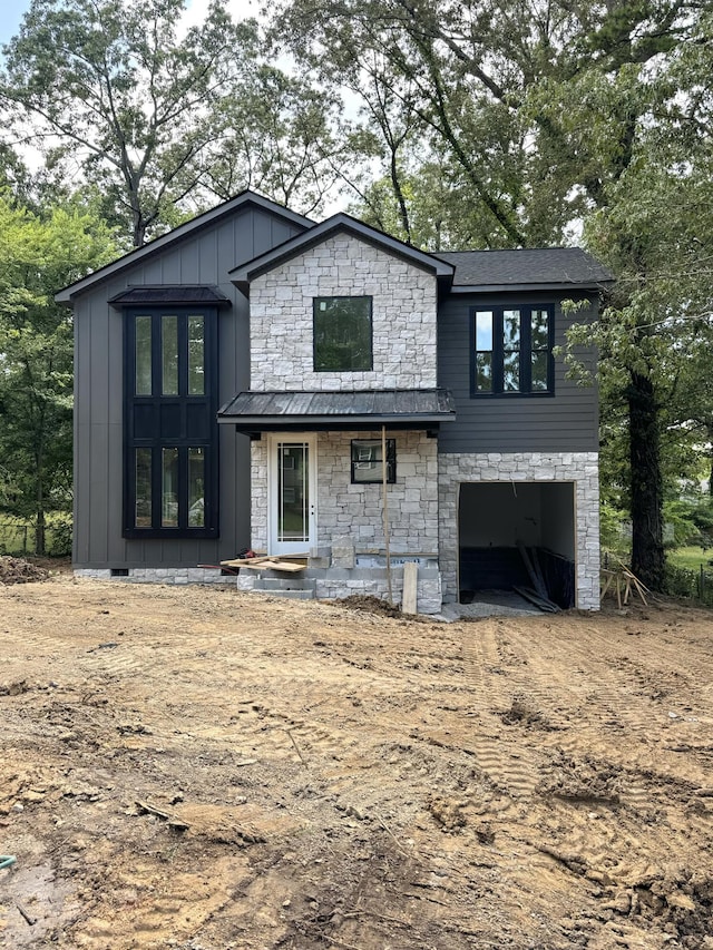 952 Lower Mill Rd, Hixson, TN 37343 - view of front of property with board and batten siding, stone siding, and a garage