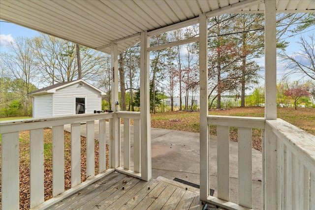 205 Polk Way, Dalton, GA 30721 - wooden terrace featuring an outbuilding and a patio area