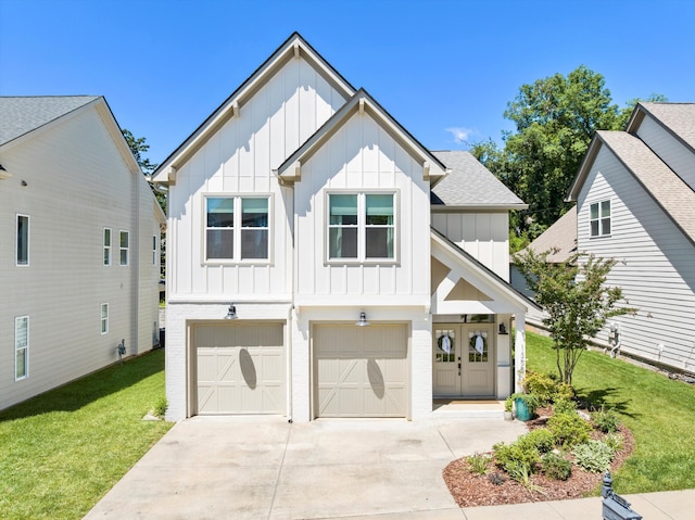 1355 Carrington Way, Chattanooga, TN 37405 - view of front of house featuring board and batten siding, driveway, a front lawn, a garage, and a shingled roof