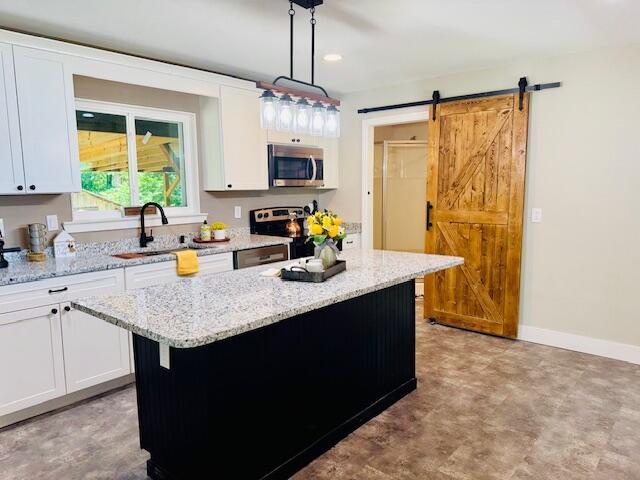 7015 Gamble Rd, Birchwood, TN 37308 - kitchen featuring appliances with stainless steel finishes, white cabinetry, a sink, and recessed lighting