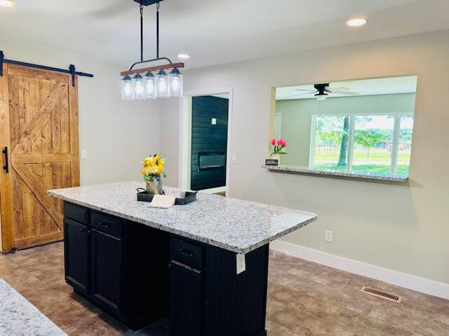 7015 Gamble Rd, Birchwood, TN 37308 - kitchen with a barn door, dark cabinets, a ceiling fan, baseboards, and recessed lighting