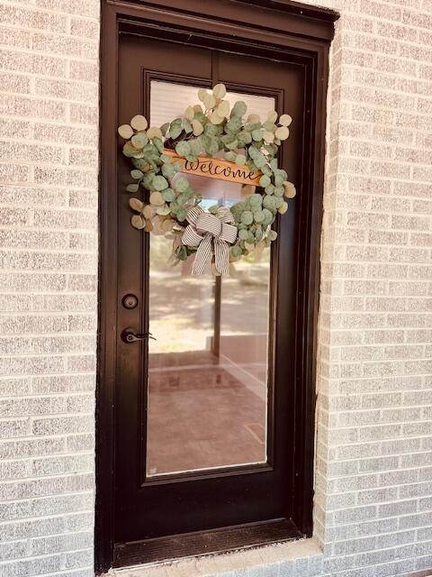 7015 Gamble Rd, Birchwood, TN 37308 - property entrance with brick siding