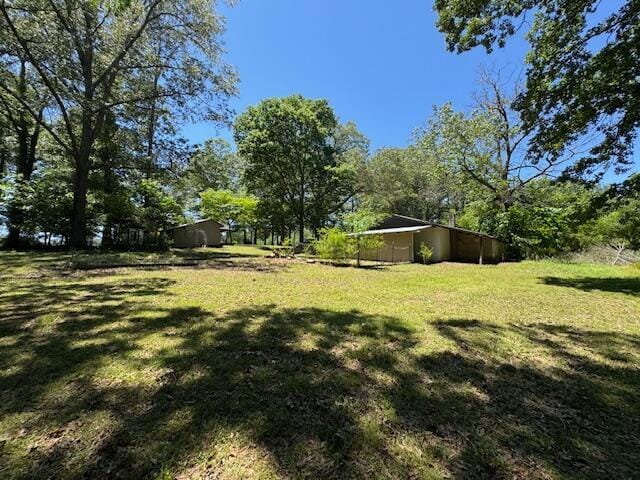 7015 Gamble Rd, Birchwood, TN 37308 - view of grassy yard featuring a carport