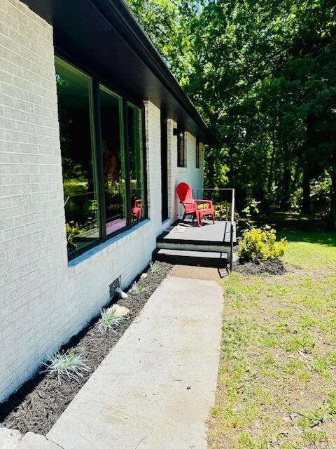 7015 Gamble Rd, Birchwood, TN 37308 - entrance to property featuring brick siding and a lawn