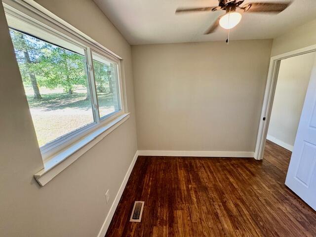 7015 Gamble Rd, Birchwood, TN 37308 - spare room with wood finished floors, ceiling fan, and baseboards