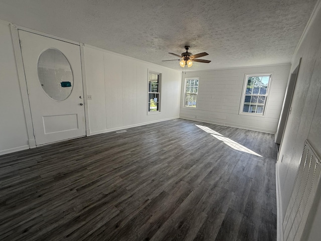 608 Bleeker St, Bridgeport, AL 35740 - unfurnished living room featuring dark wood-type flooring, ceiling fan, and a textured ceiling