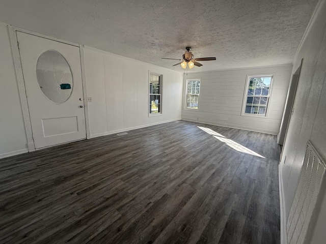 608 Bleeker St, Bridgeport, AL 35740 - unfurnished living room featuring dark wood finished floors, a ceiling fan, and a textured ceiling