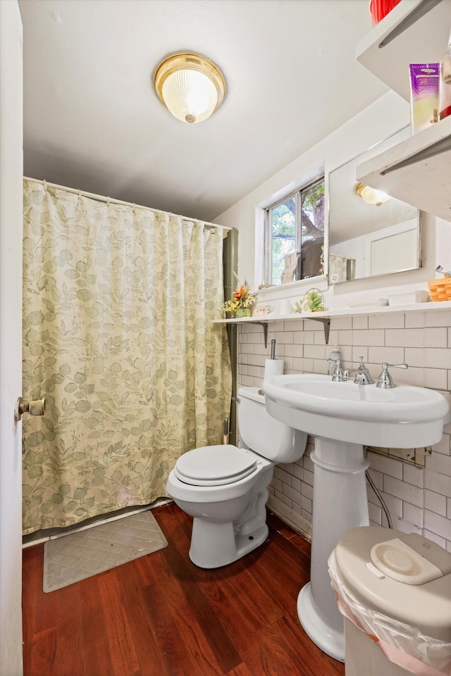 3650 Waring Rd, Dalton, GA 30721 - full bath with wood finished floors, toilet, curtained shower, and decorative backsplash