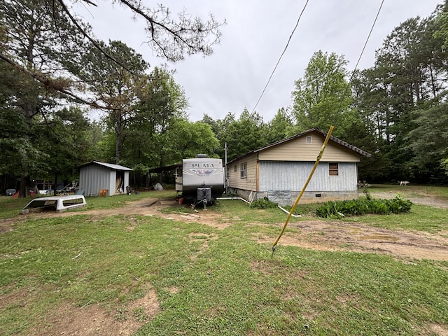 4039 Keith Valley Rd NE, Cohutta, GA 30710 - view of green lawn featuring an outdoor structure and view of scattered trees