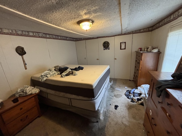4039 Keith Valley Rd NE, Cohutta, GA 30710 - bedroom with light colored carpet, a textured ceiling, and a decorative wall