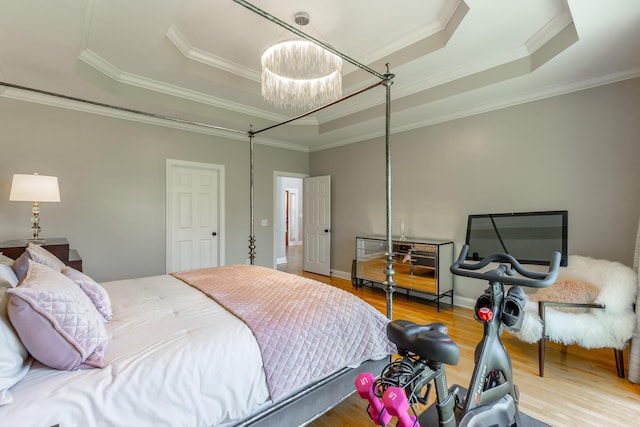 8102 Paces Ferry Xing, Chattanooga, TN 37421 - bedroom with a tray ceiling, wood finished floors, crown molding, and a chandelier