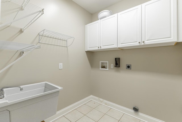 8102 Paces Ferry Xing, Chattanooga, TN 37421 - laundry room with cabinet space, baseboards, hookup for a washing machine, electric dryer hookup, and light tile patterned flooring