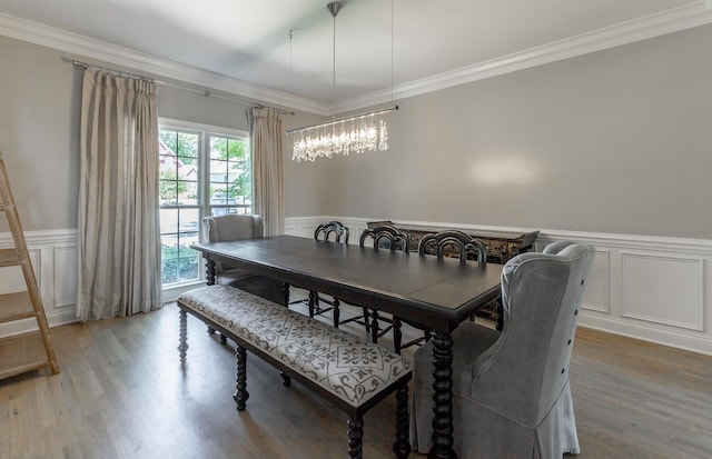 8102 Paces Ferry Xing, Chattanooga, TN 37421 - dining room with a decorative wall, crown molding, a wainscoted wall, light wood-style flooring, and a chandelier