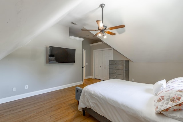 8102 Paces Ferry Xing, Chattanooga, TN 37421 - bedroom featuring lofted ceiling, wood finished floors, baseboards, ceiling fan, and a closet