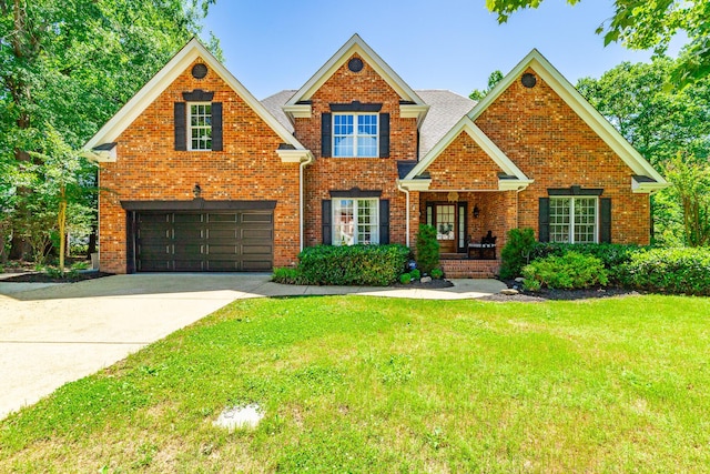8102 Paces Ferry Xing, Chattanooga, TN 37421 - traditional-style home featuring a garage, brick siding, a front yard, driveway, and a shingled roof