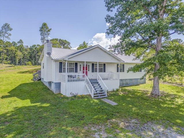 394 Nordic Rd, Crandall, GA 30711 - ranch-style house with a porch, a chimney, metal roof, stairway, and a front yard