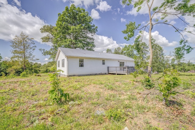 394 Nordic Rd, Crandall, GA 30711 - back of house featuring a deck and metal roof