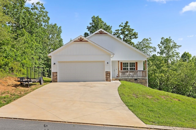 1008 Durgan Pl, Dalton, GA 30721 - view of front facade featuring an attached garage, concrete driveway, covered porch, stone siding, and a front lawn