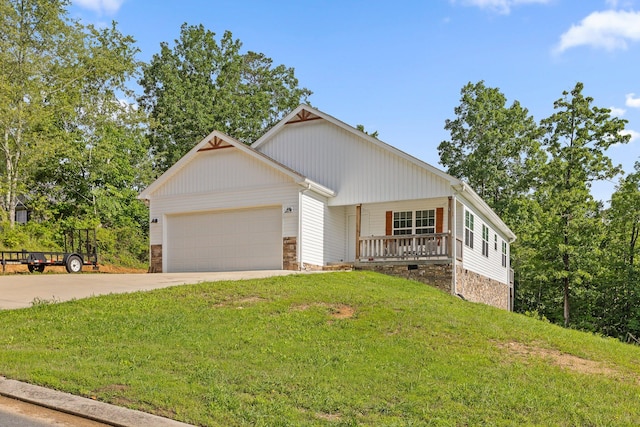 1008 Durgan Pl, Dalton, GA 30721 - view of front of house with a front yard, driveway, a garage, stone siding, and a porch