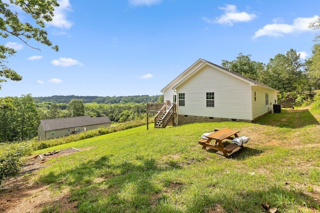 1008 Durgan Pl, Dalton, GA 30721 - view of grassy yard featuring stairs, a wooden deck, and central air condition unit