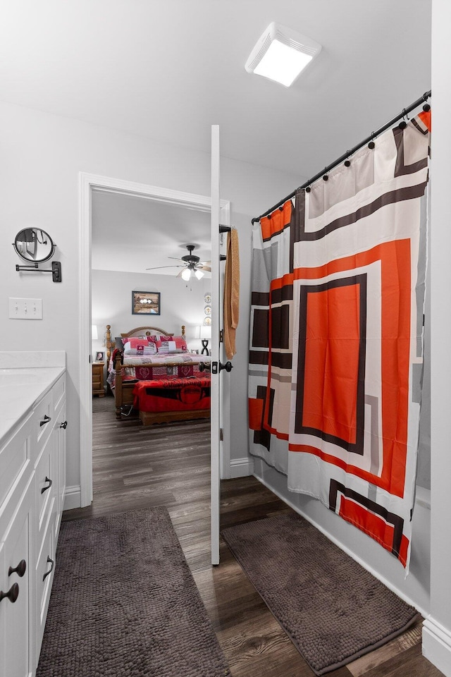 1008 Durgan Pl, Dalton, GA 30721 - full bathroom with wood finished floors, vanity, connected bathroom, a ceiling fan, and a shower with curtain