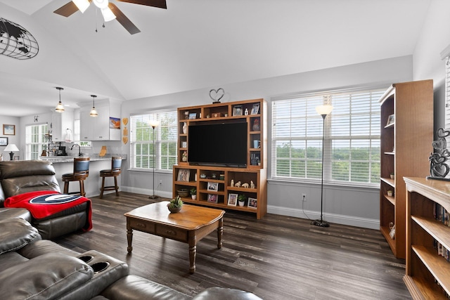1008 Durgan Pl, Dalton, GA 30721 - living room featuring lofted ceiling, baseboards, a ceiling fan, dark wood-type flooring, and plenty of natural light