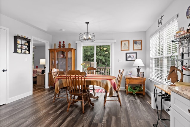 1008 Durgan Pl, Dalton, GA 30721 - dining area with a chandelier, dark wood finished floors, and baseboards