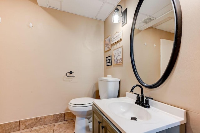 2049 Saunders Rd, Ringgold, GA 30736 - half bathroom featuring toilet, vanity, and a drop ceiling