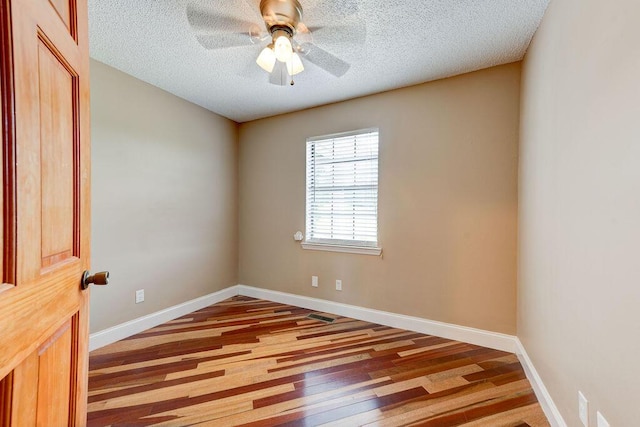 2049 Saunders Rd, Ringgold, GA 30736 - unfurnished room with wood finished floors, a textured ceiling, ceiling fan, and baseboards