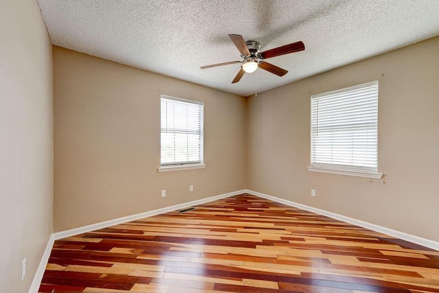2049 Saunders Rd, Ringgold, GA 30736 - unfurnished room with hardwood / wood-style flooring, a ceiling fan, baseboards, and a textured ceiling
