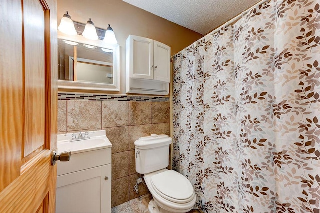 2049 Saunders Rd, Ringgold, GA 30736 - bathroom featuring tile walls, vanity, toilet, a textured ceiling, and a shower with shower curtain