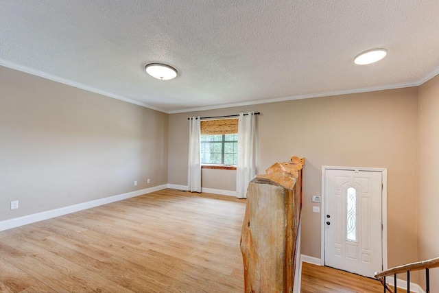 2049 Saunders Rd, Ringgold, GA 30736 - foyer with a textured ceiling, light wood-style floors, crown molding, and baseboards