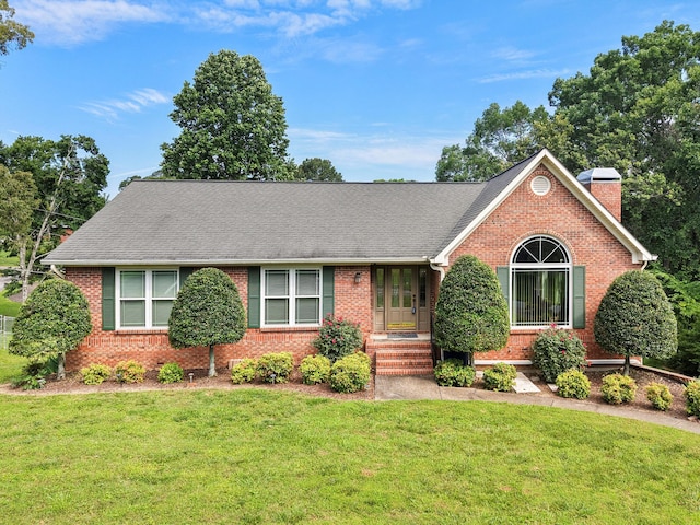 4015 Patton Edwards Dr, Chattanooga, TN 37412 - ranch-style home featuring brick siding, a chimney, and a front lawn