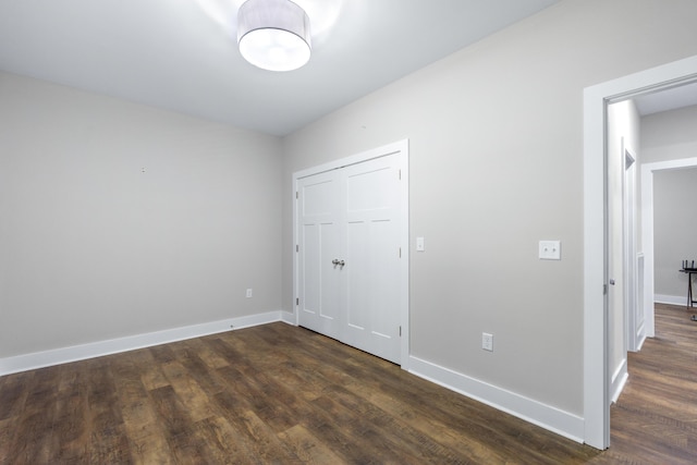 141 Woodland Way, Signal Mountain, TN 37377 - unfurnished bedroom with dark wood-style floors, baseboards, and a closet