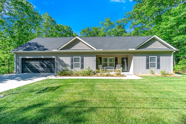 141 Woodland Way, Signal Mountain, TN 37377 - view of front facade with a garage, covered porch, driveway, and a front lawn