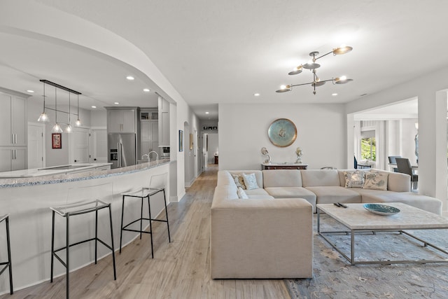 4274 Lakeshore Ln Unit 102, Chattanooga, TN 37415 - living area featuring light wood-style floors, a chandelier, and recessed lighting
