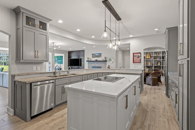 4274 Lakeshore Ln Unit 102, Chattanooga, TN 37415 - kitchen featuring dishwasher, black electric stovetop, gray cabinetry, a sink, and a kitchen island