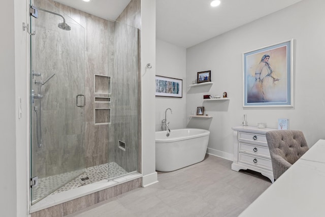 4274 Lakeshore Ln Unit 102, Chattanooga, TN 37415 - bathroom featuring a freestanding bath, a shower stall, baseboards, vanity, and recessed lighting