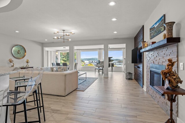 4274 Lakeshore Ln Unit 102, Chattanooga, TN 37415 - living area with light wood-type flooring, recessed lighting, and a glass covered fireplace