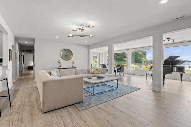 4274 Lakeshore Ln Unit 102, Chattanooga, TN 37415 - living area with plenty of natural light, a chandelier, light wood finished floors, recessed lighting, and baseboards
