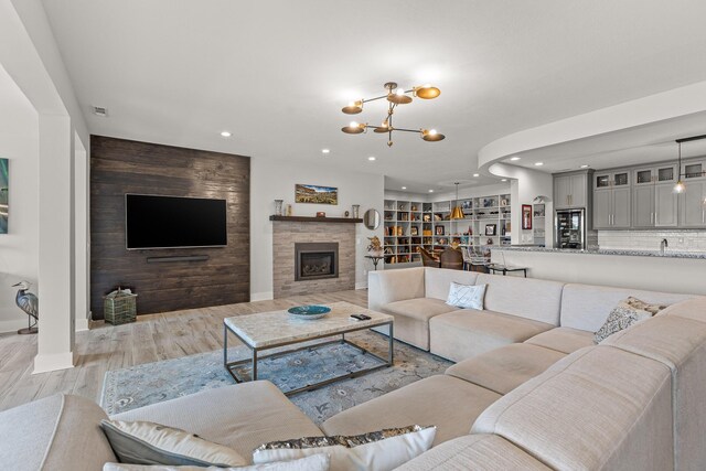 4274 Lakeshore Ln Unit 102, Chattanooga, TN 37415 - living area featuring recessed lighting, light wood finished floors, a chandelier, a fireplace, and baseboards