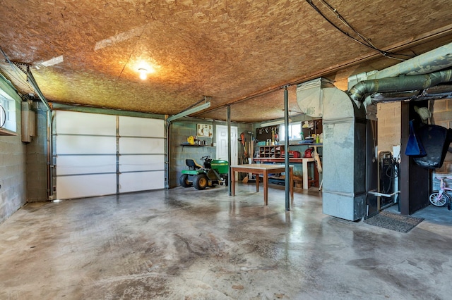 971 Hamilton Cir NW, Cleveland, TN 37312 - garage featuring concrete block wall and heating unit