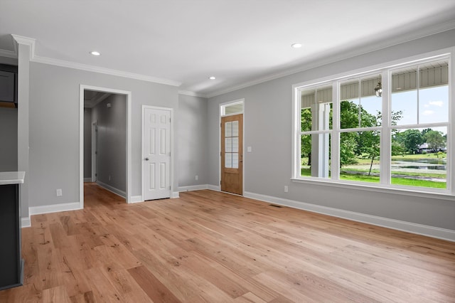 338 Kerry Ln, Soddy Daisy, TN 37379 - unfurnished living room featuring baseboards, ornamental molding, light wood finished floors, and recessed lighting