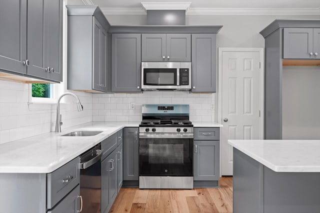 338 Kerry Ln, Soddy Daisy, TN 37379 - kitchen with stainless steel appliances, gray cabinets, and crown molding