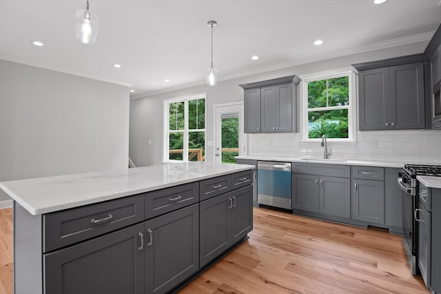 338 Kerry Ln, Soddy Daisy, TN 37379 - kitchen with stainless steel dishwasher, gray cabinets, a sink, crown molding, and backsplash